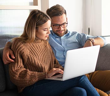 about-bioidentical-hormone-doctors-locator happy couple researching customized testosterone therapy and hormone optimization treatments online together