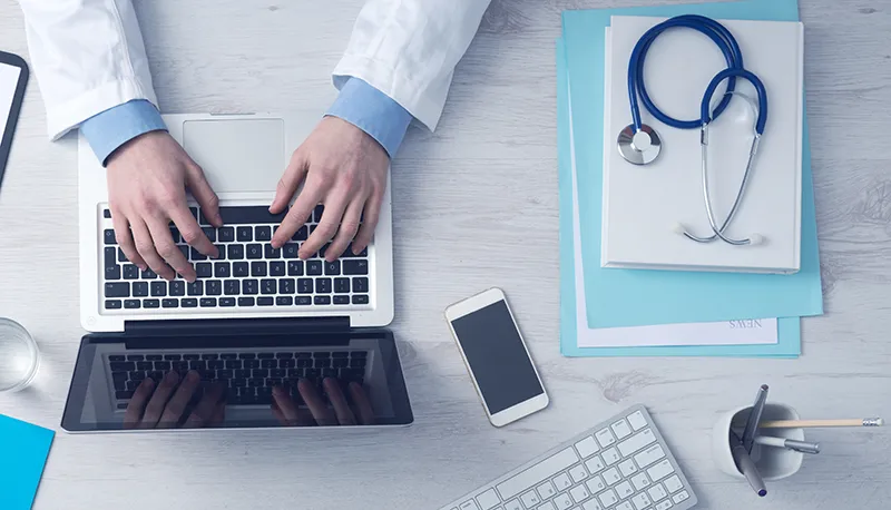 join-the-directory Testosterone Doctor making customized testosterone therapy and hormone optimization treatments notes on laptop